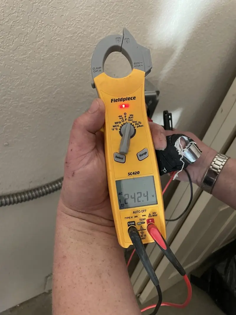 Voltage testing with clamp meter during Whole House Surge Protector in Sequim